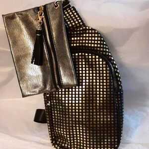 Sling bag. Good for travel/ on the go. Gold pot a dot on Black.